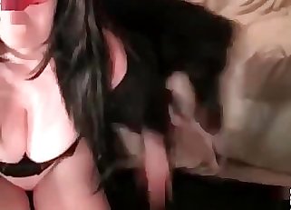 Pet is being pleased by a hooded gal